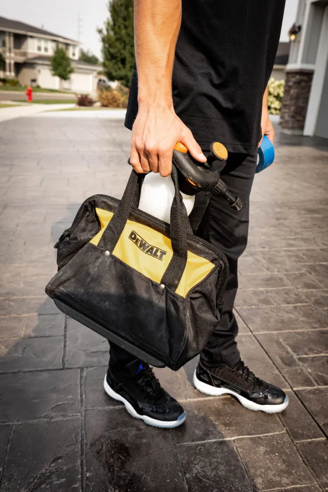 employee carrying tool bag